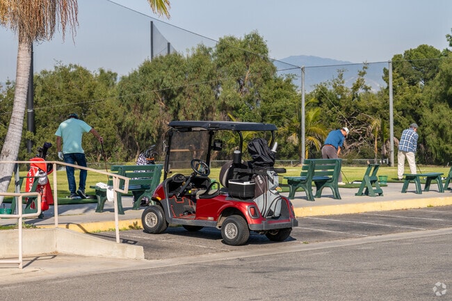Laguna Woods residents take golf carts to the driving range to practice their swings.