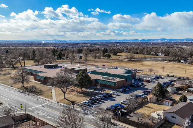 The parking area and main building at Woodglen Elementary School in Thornton, Colorado.