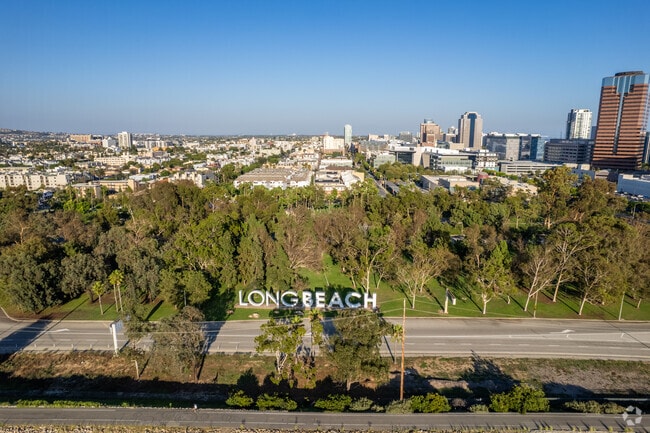 An elevated shot of West Village-Long Beach shows Cesar E Chavez Park and nearby residents.