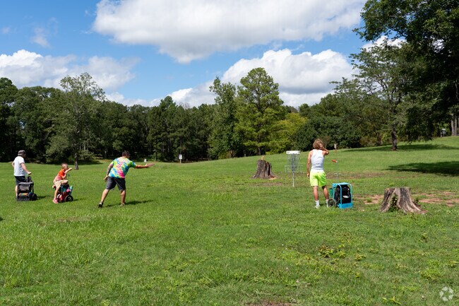 Many residents of Good Earth enjoy playing disc golf on weekends.