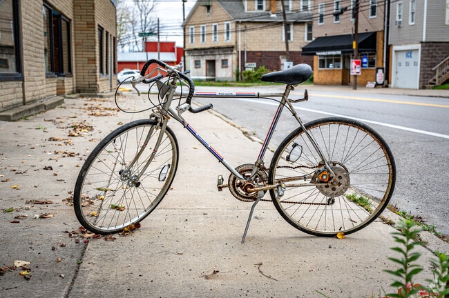 A bicycle stands on the sidewalk along Route 18 in the neighborhood of Smith Township.