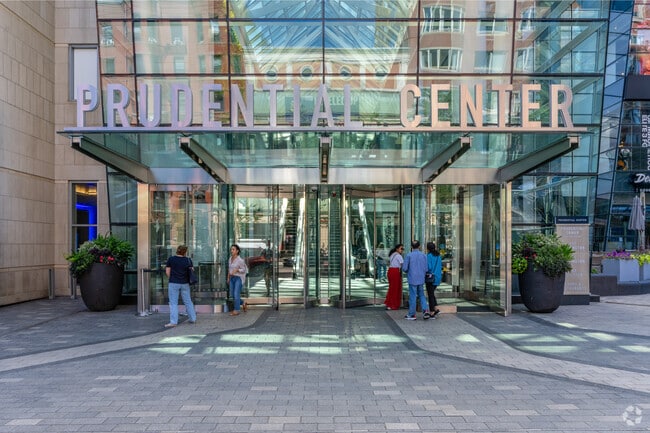 Shoppers come and go at the bustling Prudential Center shops on Boylston Street in the Back Bay.