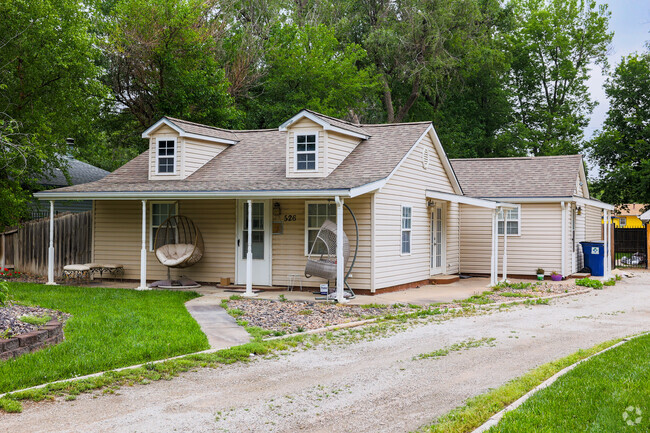 Several of the Orchard Breeze homes have dirt and gravel driveways.