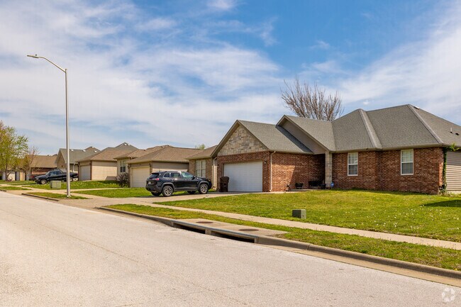 Contemporary Ranch Style Homes Line a Neighborhood Street in the Young-Lilley Neighborhood