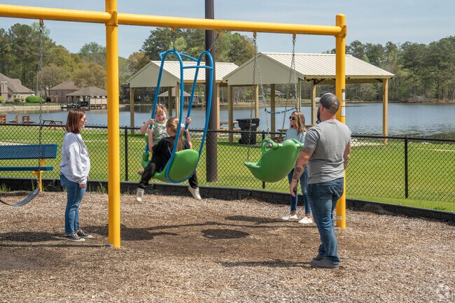 Parents enjoy taking their kids to play on the playground at Southside Landing on a beautiful spring day.