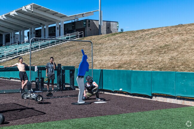 Baseball players practice at UVU’s baseball field near Lakeview.