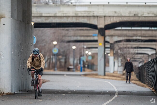 A cyclist making their way down the greenway near the Whittier neighborhood.
