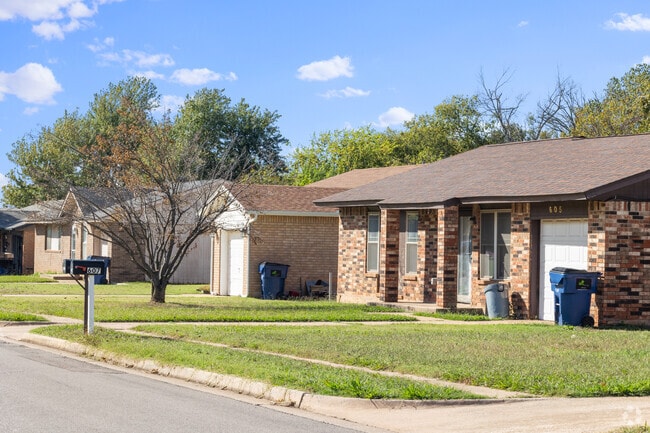 A row of homes in Noble shows a mix of ranch and Craftsman styles.
