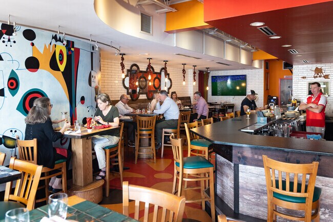 Stop by for happy hour at a bar & grill in Downtown Clayton.