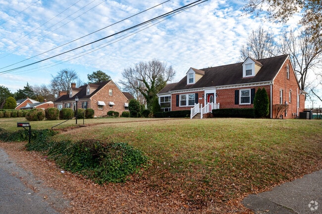 Street with cozy Cape Cod houses in East Highland neighborhood.