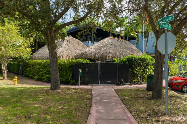 Students love the straw roofs at Papillon Montessori school.