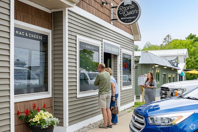 An outdoor ordering window makes summer lunches a breeze at Stone Oven near Hardwood Acres.