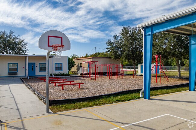 Kids enjoy outdoor play on the sports courts at Tarpon Springs Fundamental Elementary.