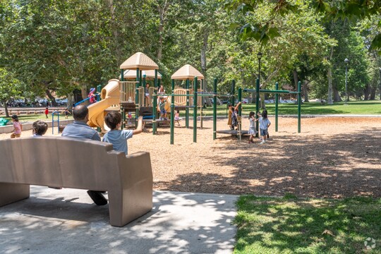 Children climb, slide, and swing with joy at the colorful playground in Verdugo Park in Glendale.