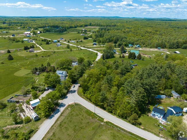 Homes on acreage and small farms spread across Arundel’s countryside.