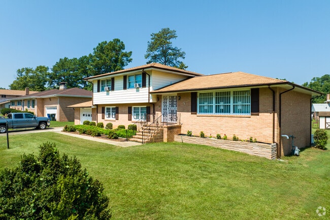 Spit-level homes in Ettrick sit on lots with simple landscaping.