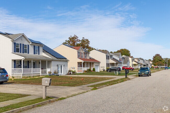 Rows of modern colonial stye homes occupy tree lined streets in Pomona.