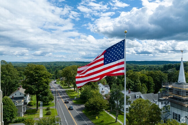 Newtown’s flagpole on Main Street is a beloved landmark and gathering point.
