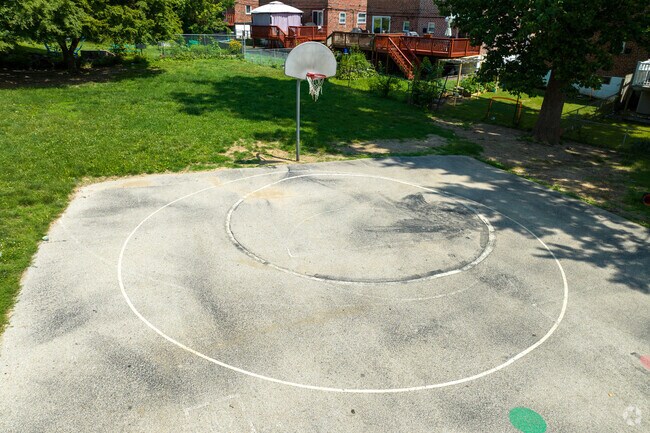 Half-court basketball is popular among students at Charles Kelly Elementary School.