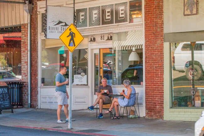 Residents enjoy dining al fresco along the charming sidewalks of downtown Sonora's main street, savoring delicious meals while soaking in the vibrant atmosphere.