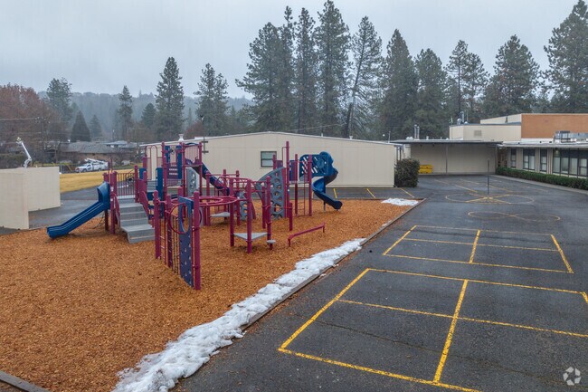 Indian Trail Elementary features a play structure behind the school for its students.