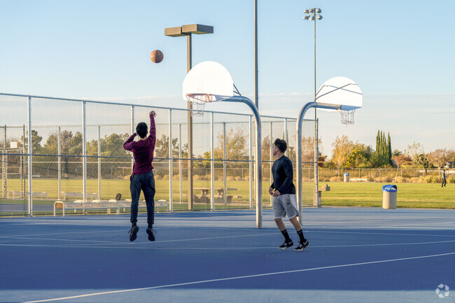 Challenge your friends to a game of basketball at Sunset Ridge Park.