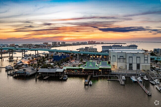San Carlos Island comes alive in the night time after the sun sets below the Gulf of America.