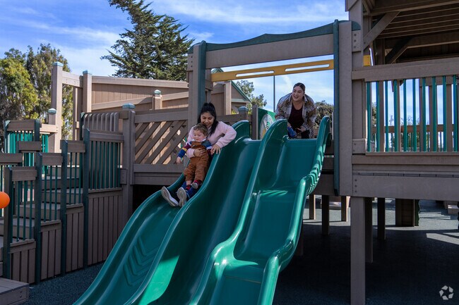 Sliding into pure joy together at Tatum's Garden.