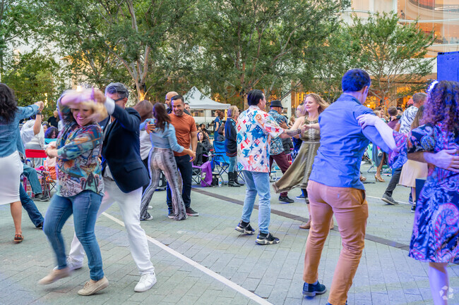 Northside Costa Mesa residents enjoying Summer Sounds at the Julianne and George Argyros Plaza.