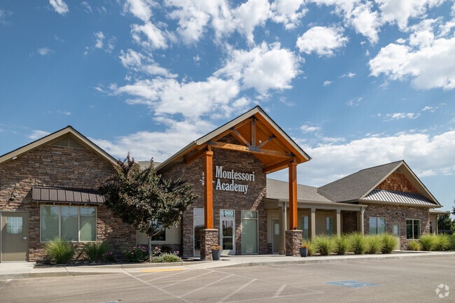 The south entrance of Montessori Academy features beautiful wood and stone details.