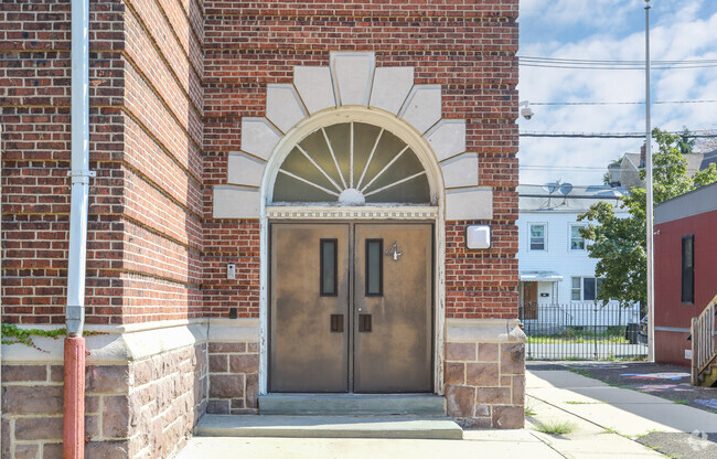 The entrance to Harrison Elementary School features ornate structural details.