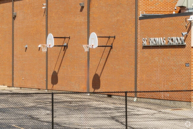 Students can practice hoops at the courts behind St. Thomas the Apostle Catholic School.
