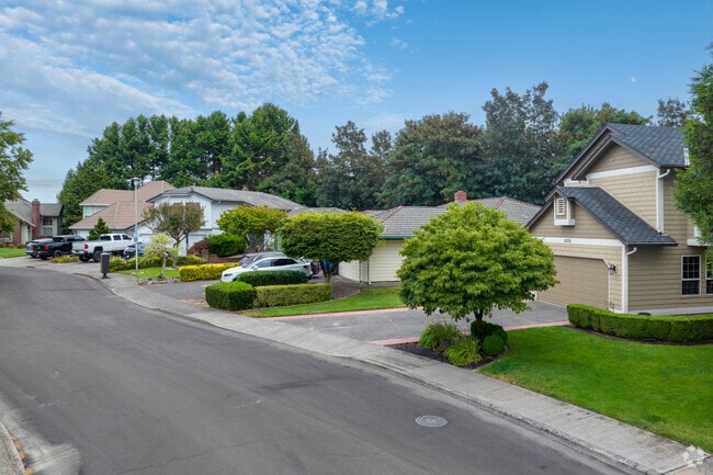 Sidewalks and sleek homes define NE 160th Loop in Cimarron.
