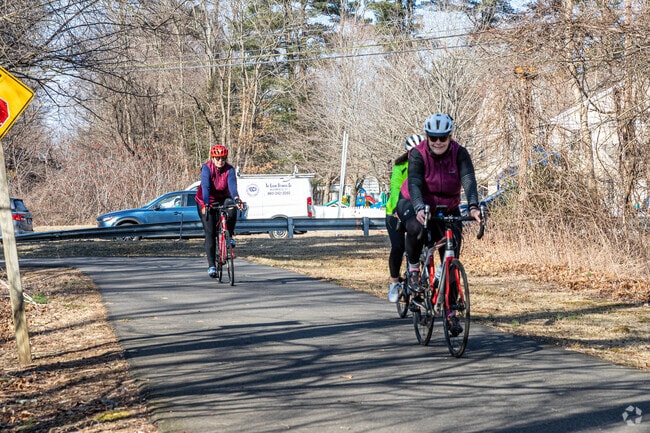Cyclists ride the Farmington Canal Heritage Trail through Simsbury.