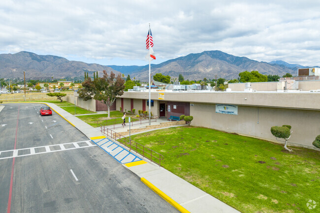 Proudly soaring, the flag adorns Thompson Elementary School.