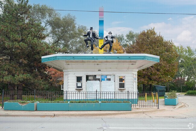 The Blues Brothers, sing a dance on the roof of Rich & Creamy in Joliet, Illinois.