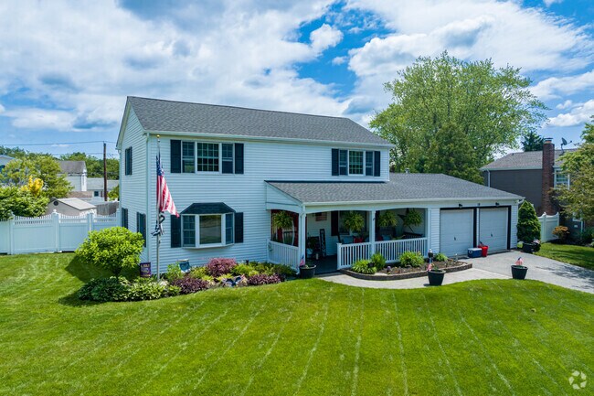 There are gorgeous Colonial homes with manicured lawns in Lake Grove.
