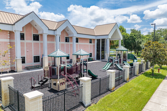 Kids enjoy playing on the play area at First Christian Academy.