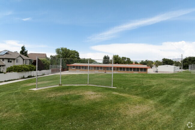 A baseball field on a vibrant lawn at Rosecrest Elementary School.
