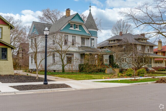 A Queen Anne Victorian sits beside an American Foursquare in the Historic District.