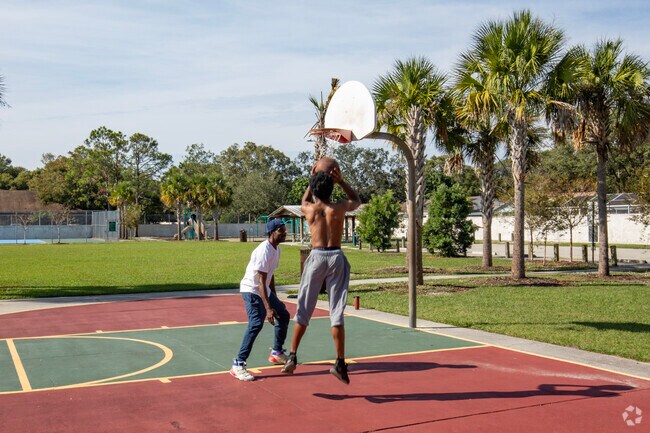 These residents enjoy a game at one of the many parks in the Lake Magdalene area.
