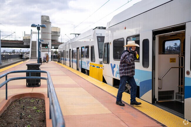 A man taking the light rail in the silver leaf neighborhood.