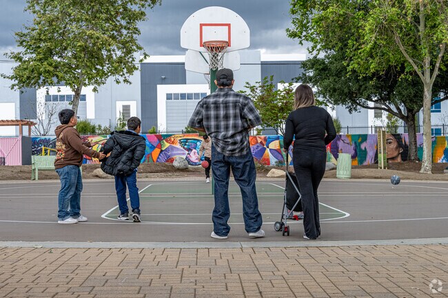 A local family is enjoying the basketball courts at Gibson Mariposa Park in the Northwest El Monte neighborhood.