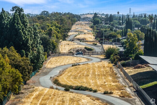 Enjoy peaceful strolls on scenic walking trails winding through the neighborhood.