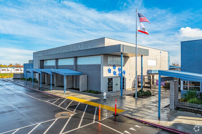 Flags fly high at the entrance of Greer Elementary School.