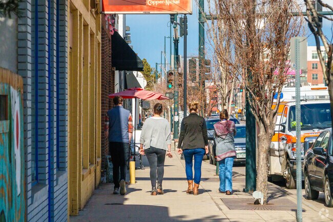 Broadway’s vibrant shops await in the heart of Cushing Park, Englewood.