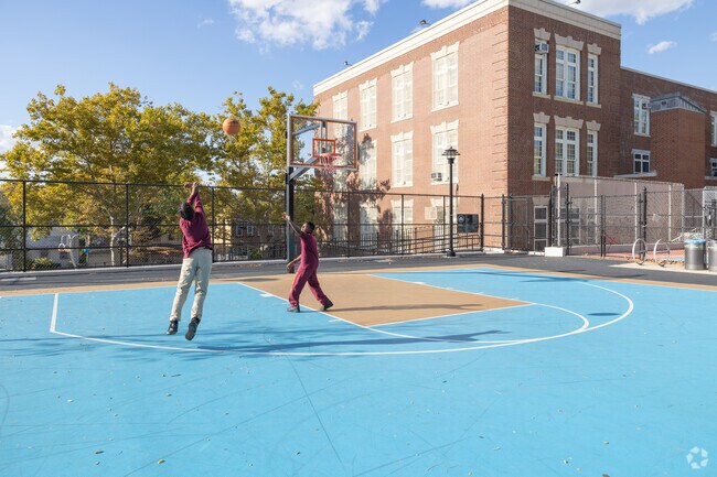 Friends meet after school to play basketball in Wakefield Playground.