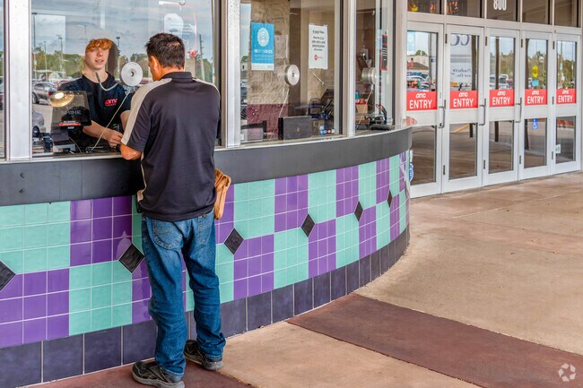 AMC Theatre is located at the Merchant's Crossing Plaza in the neighborhood of Diplomat.