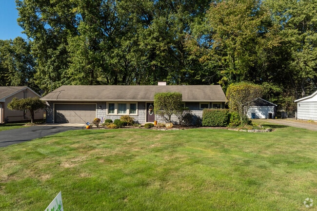 Nestled on a large lot in Howling Center, this ranch-style home features an attached two-car garage for your convenience.