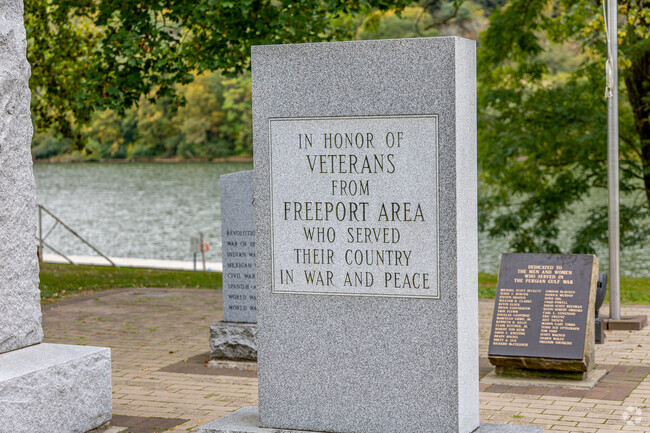 A cluster of monuments dedicated to veterans is located near Riverside Park in Freeport.